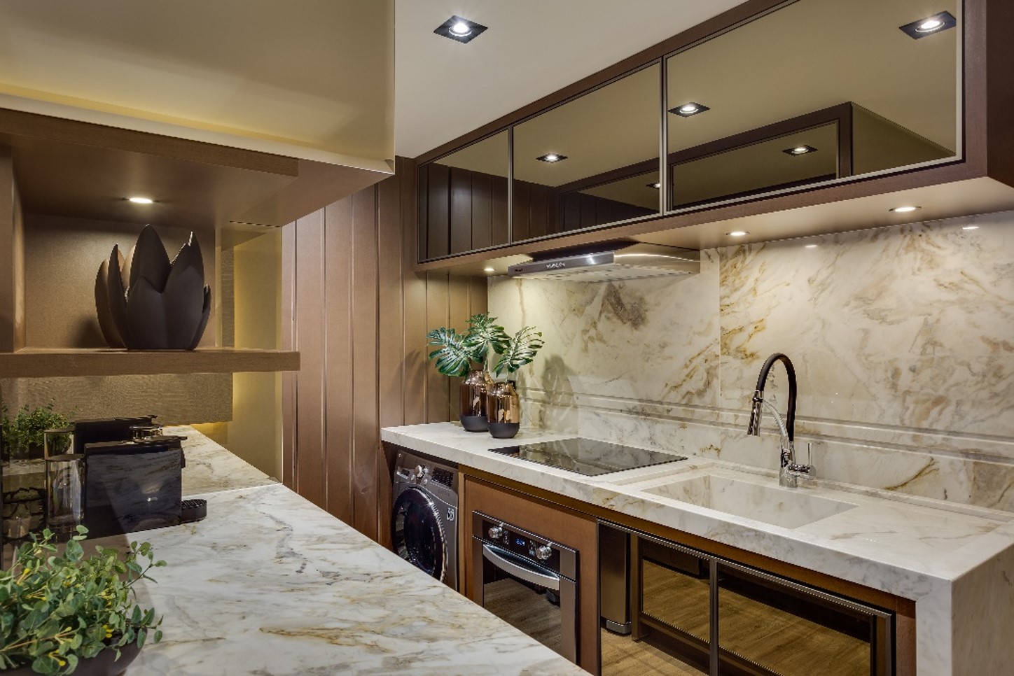 Kitchen with stone countertop and wall cladding